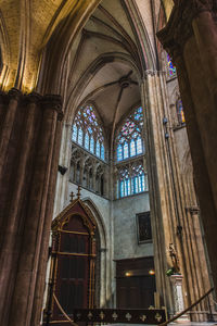 Low angle view of stained glass window in building