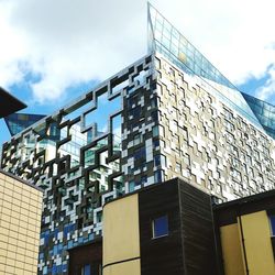 Low angle view of office building against sky