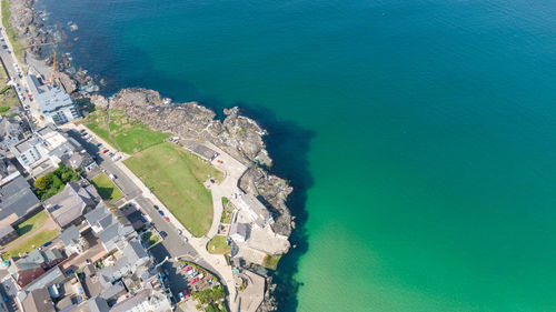 High angle view of buildings by sea