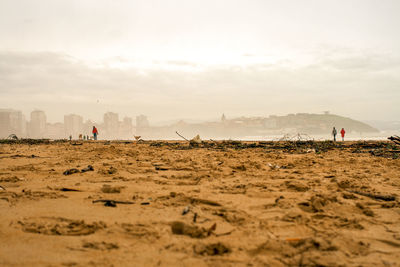 Scenic view of beach against foggy sky