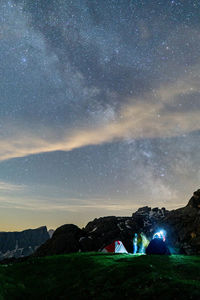 Scenic view of mountains against sky at night