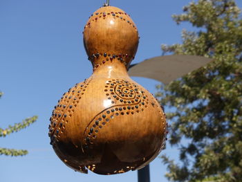 Low angle view of decoration hanging against sky