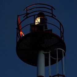 Low angle view of tower against blue sky