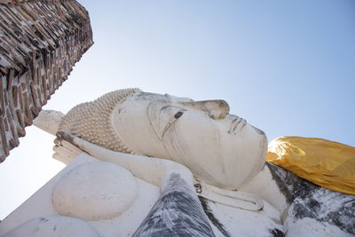 Low angle view of statue against sky