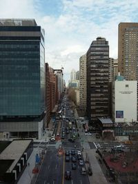 City street against cloudy sky