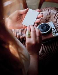 Midsection of woman using mobile phone