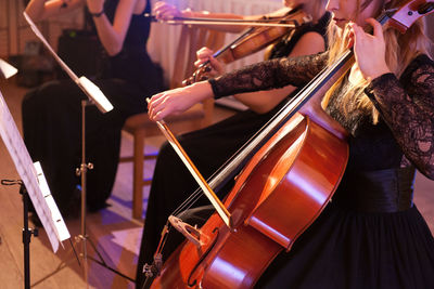 View of women playing string instruments