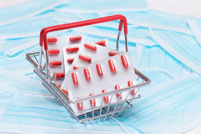 Close-up of small shopping cart on table
