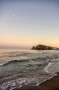 Scenic view of sea against clear sky during sunset