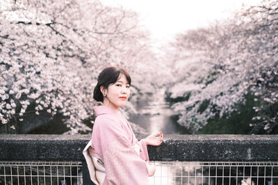 Side view of a young woman looking away