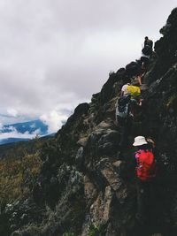 Scenic view of mountains against cloudy sky