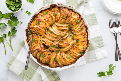 Cheesy au gratin scalloped potatoes, ready for serving.