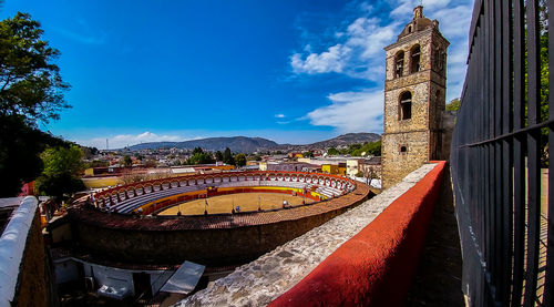 View of cityscape against blue sky