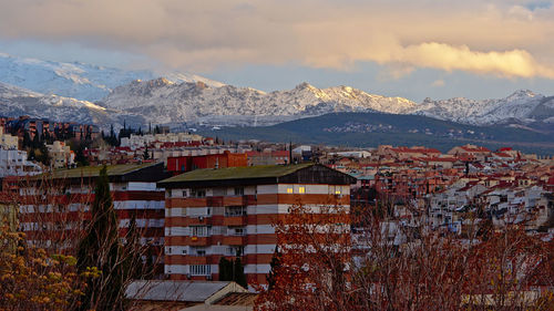 Buildings in city against sky