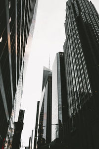 Low angle view of skyscrapers against sky