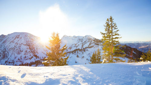 Scenic view of snow covered mountains against sky