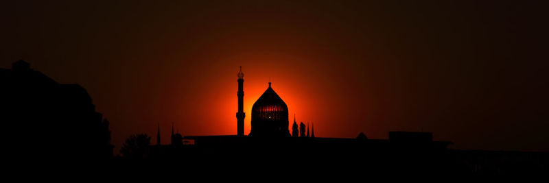 Silhouette temple against sky during sunset