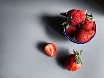 High angle view of strawberries in bowl on table