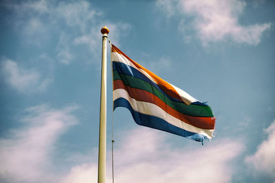 Low angle view of flag against sky