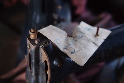 Sewing machine with the name of worker in an abandoned shoe factory