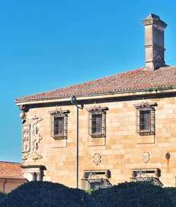 Low angle view of building against clear blue sky. medieval palace