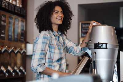 Happy owner working at coffee roastery