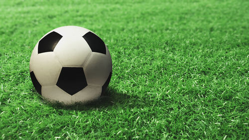 Close-up of soccer ball on field