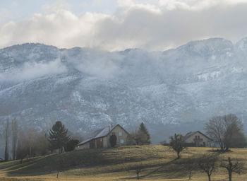 Scenic view of landscape and mountains against sky