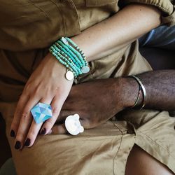 Midsection of couple wearing rings