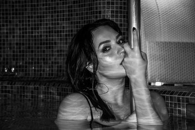 Portrait of beautiful woman in swimming pool