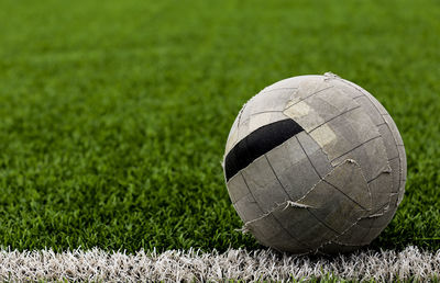 Close-up of soccer ball on field