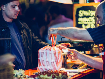 Group of people at market stall