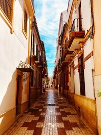 Alley amidst buildings in city