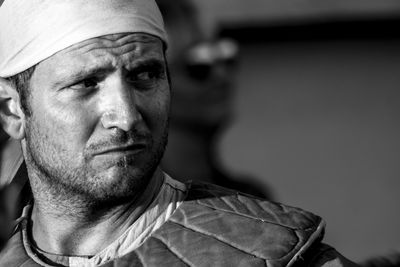 Close-up portrait of man wearing bandana