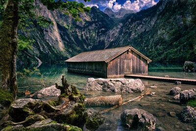 Scenic view of house in lake against mountain