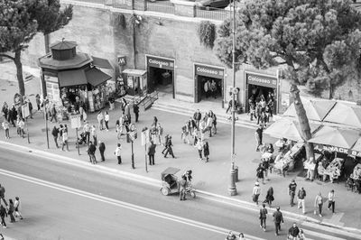 People walking on road in city