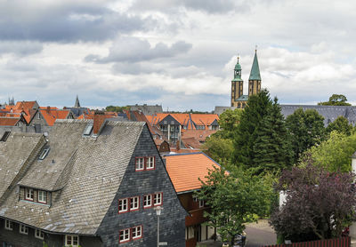 Buildings in city against sky