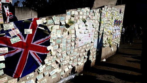 Close-up of flags against built structure