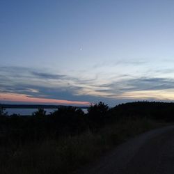 Scenic view of sea against sky at sunset