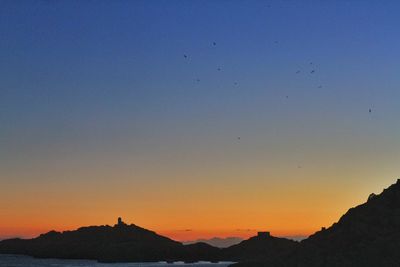 Scenic view of mountains at sunset