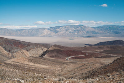 View of landscape with mountain range in the background