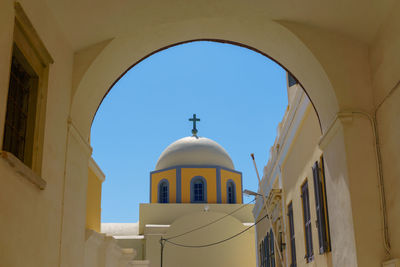 Low angle view of building against clear blue sky