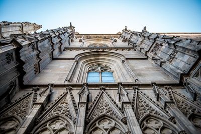 Low angle view of ornate building against sky