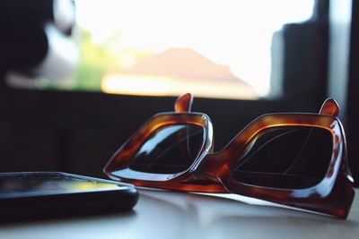 Close-up of sunglasses on table