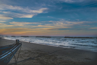 Scenic view of beach against sky during sunset