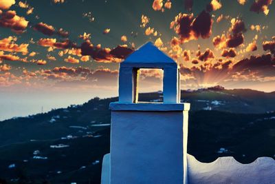 Built structure against sky during sunset