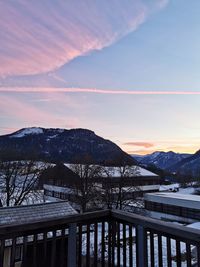 Scenic view of snowcapped mountains against sky during sunset