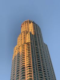 Low angle view of modern building against clear blue sky