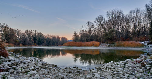 Scenic view of lake against sky during autumn