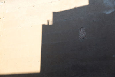 Close-up of shadow on brick wall